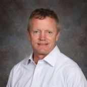 Headshot image of superintendent wearing white button up