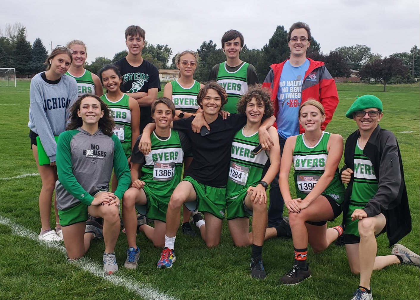Cross Country team picture at a meet along with an old coach Mr. Moahoney.