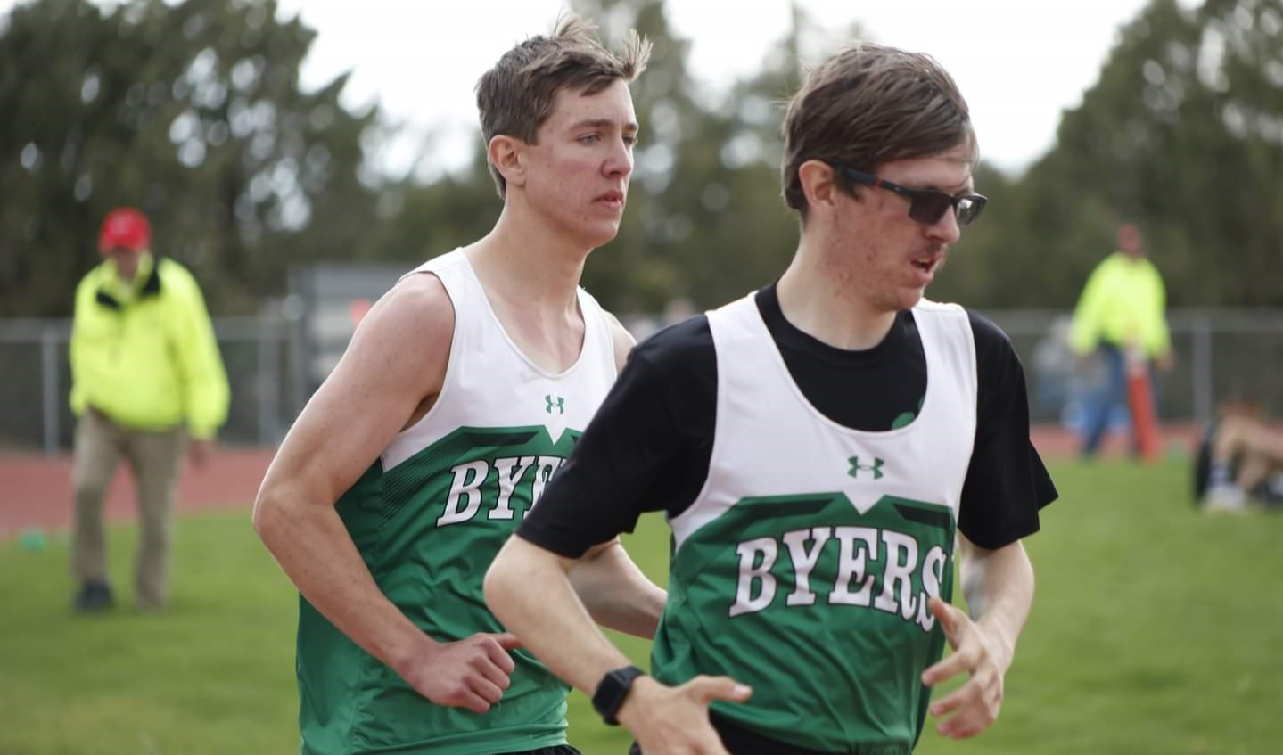 2 High School Track boys running the mile running the mile.