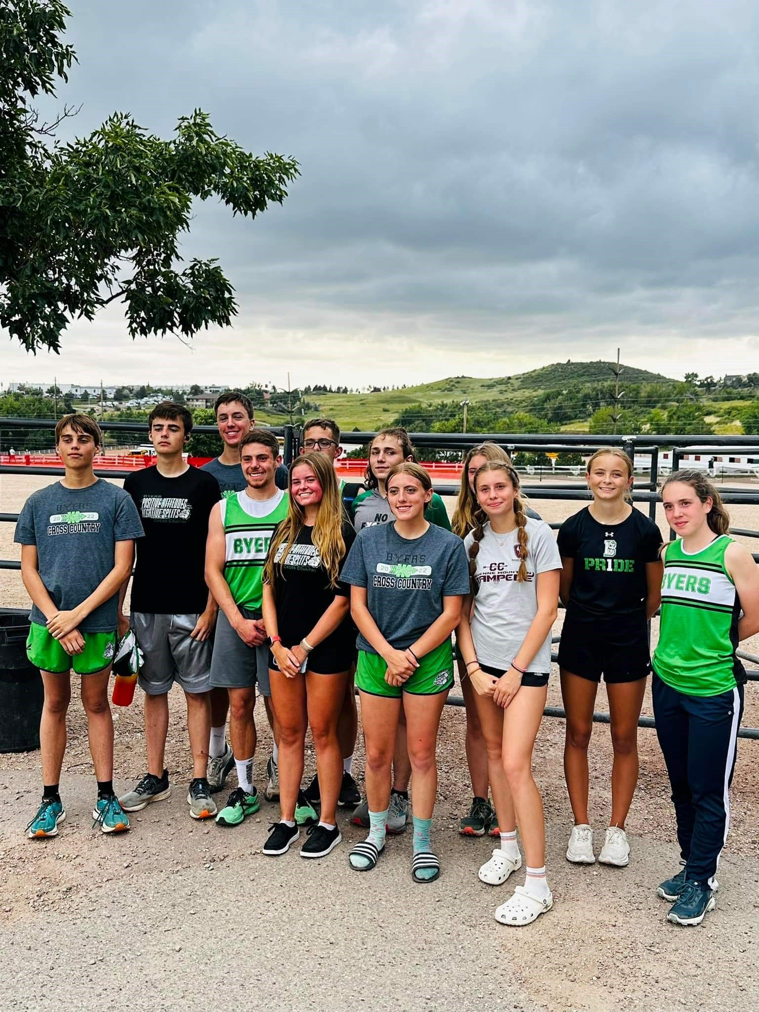 The Cross Country group together in uniform at a meet.