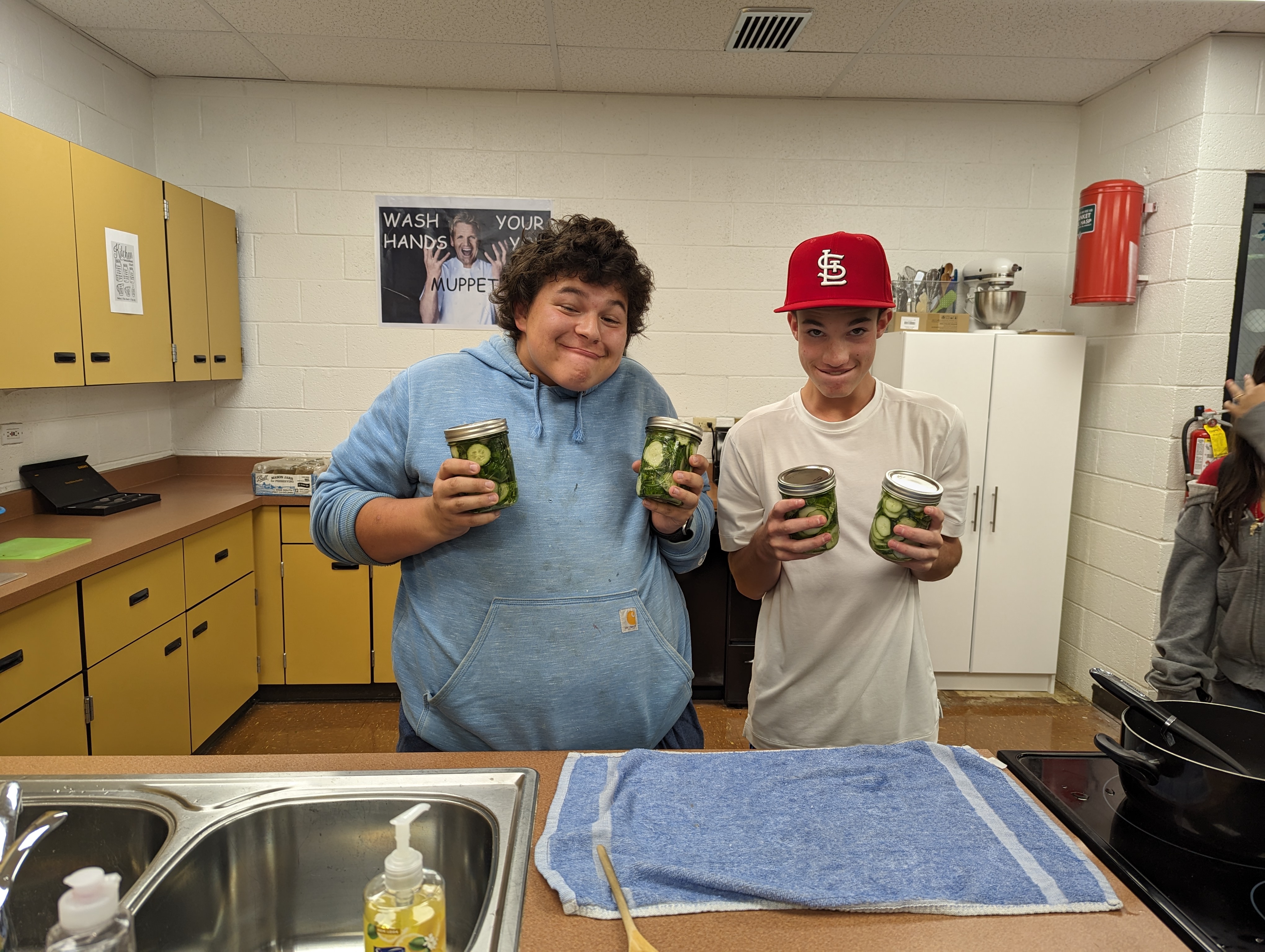 2 boys making pickles in Foods.