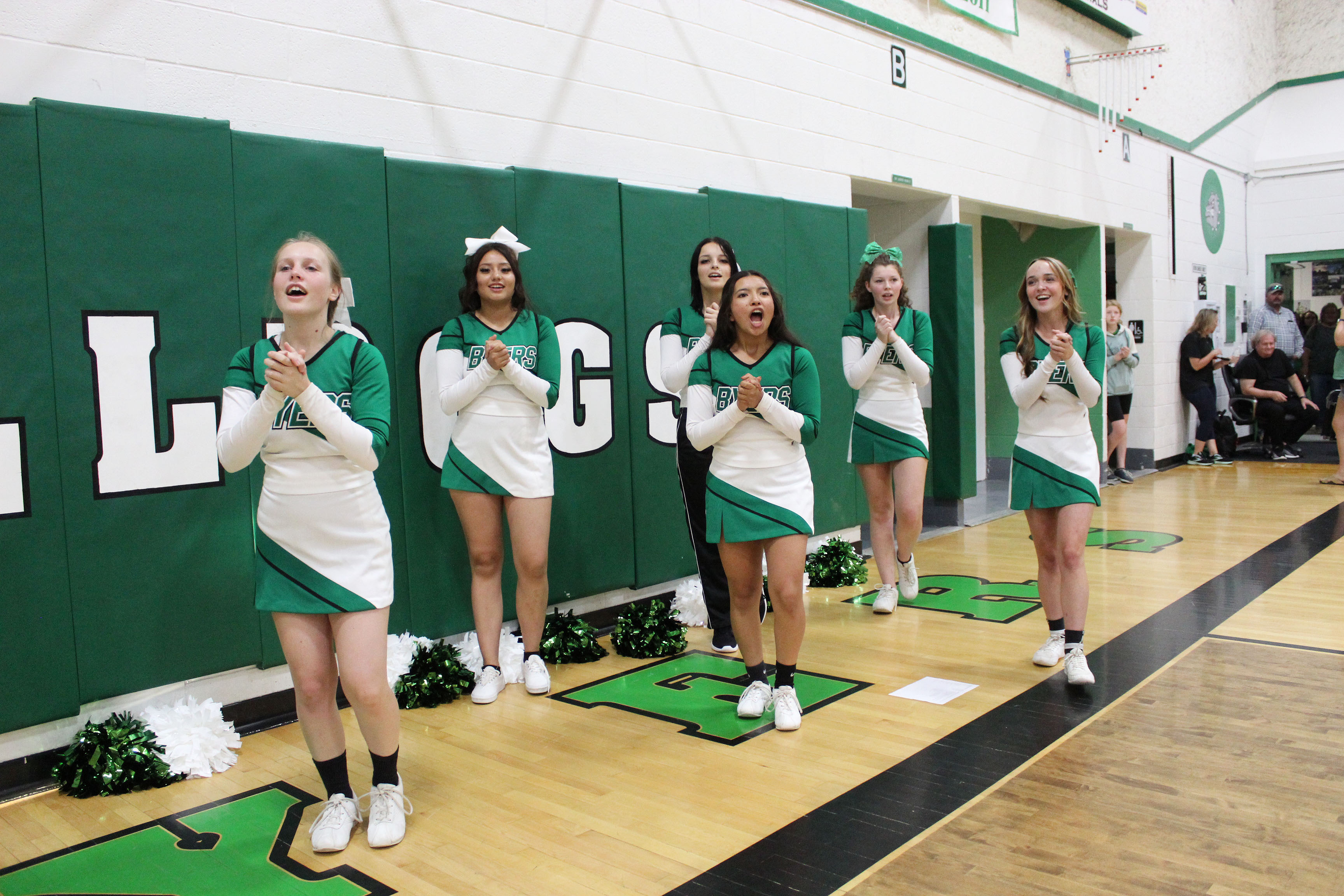 Byers Cheer on the sidelines cheering for volleyball team