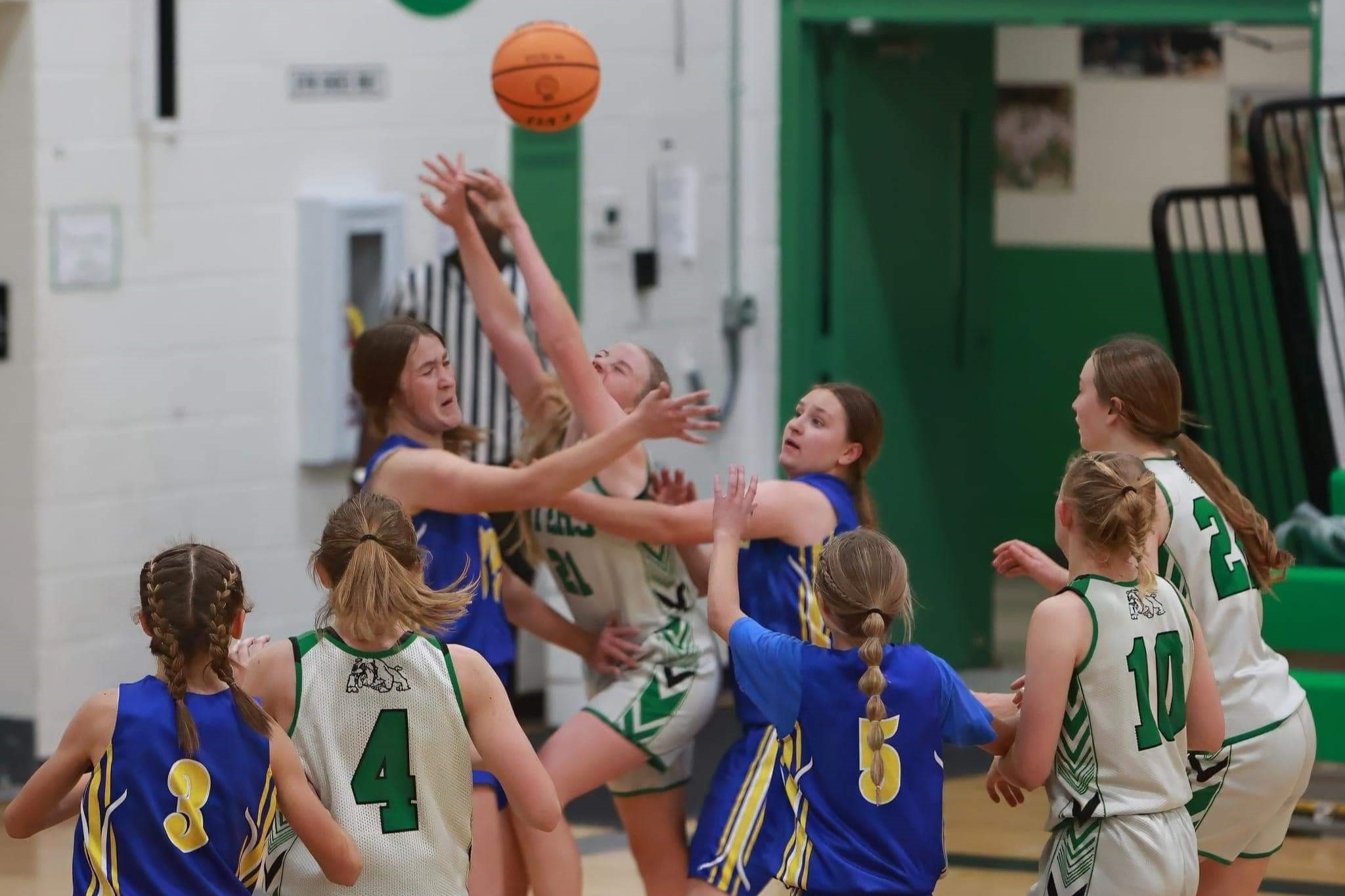 Byers girls vs Simla all gilrs trying to get the ball.