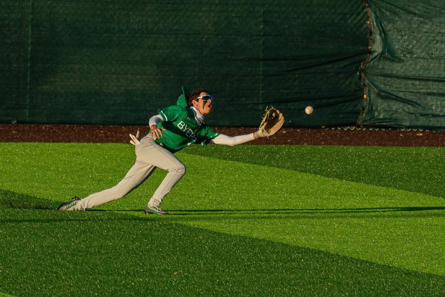 Byers Baseball player diving for the ball