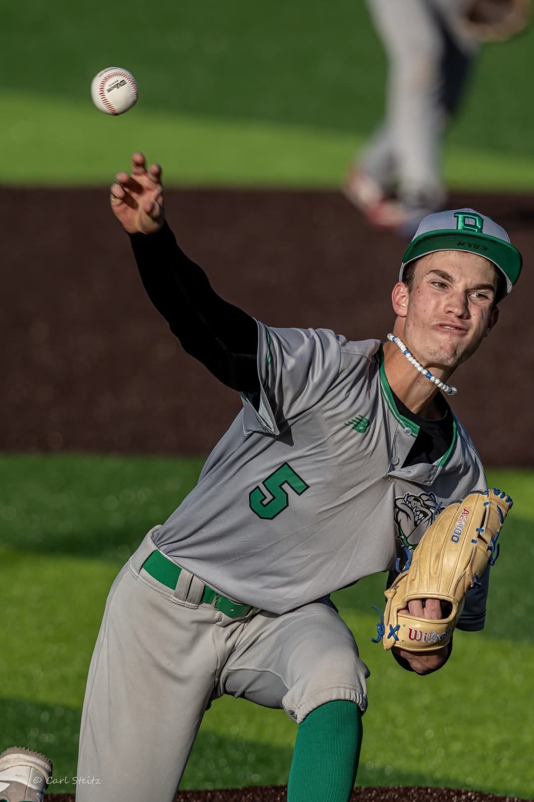Kaden Bennett Throwing a pitch hoping to strick someone out
