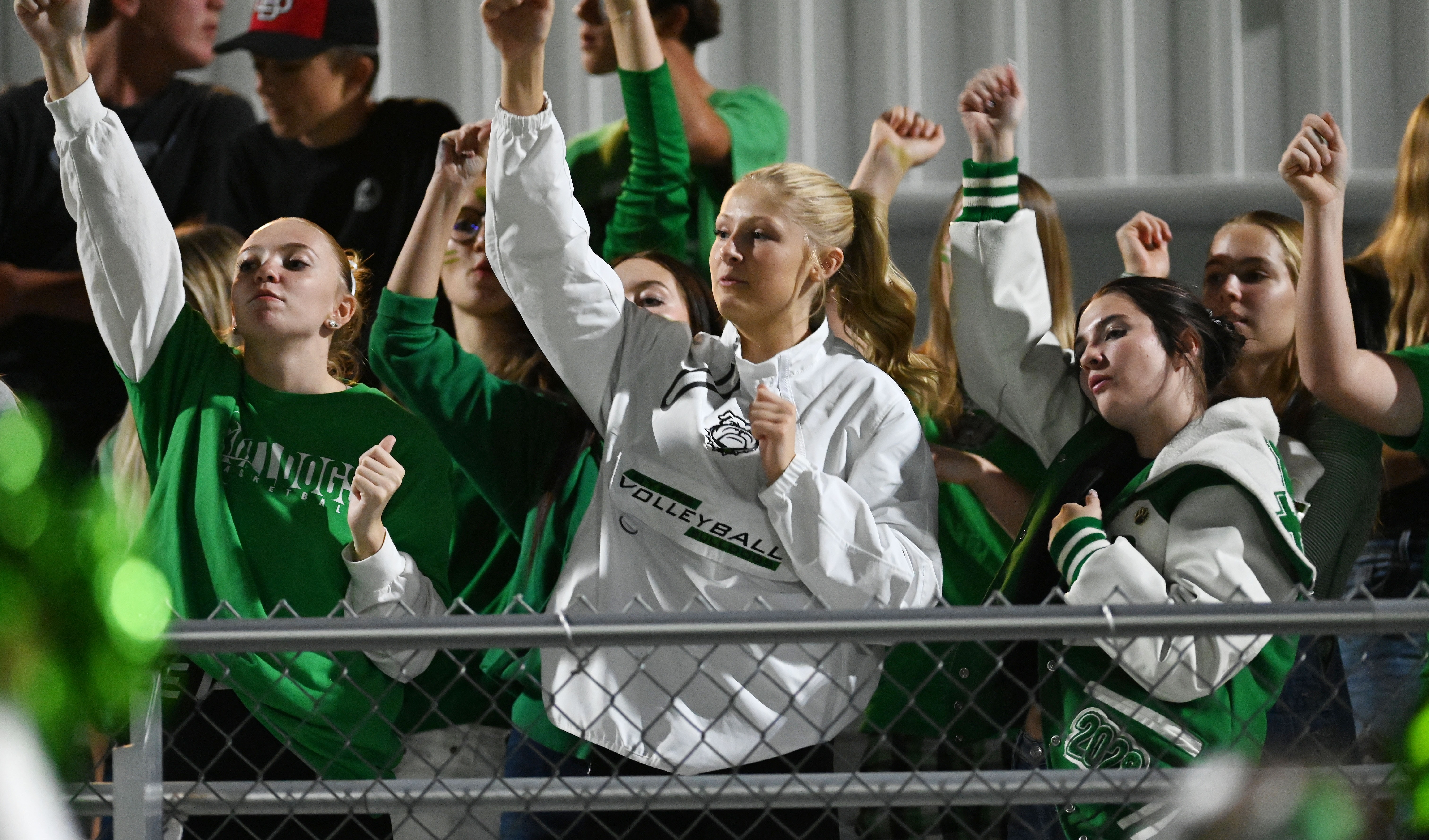 Byers girls in the student section cheering on the football team.