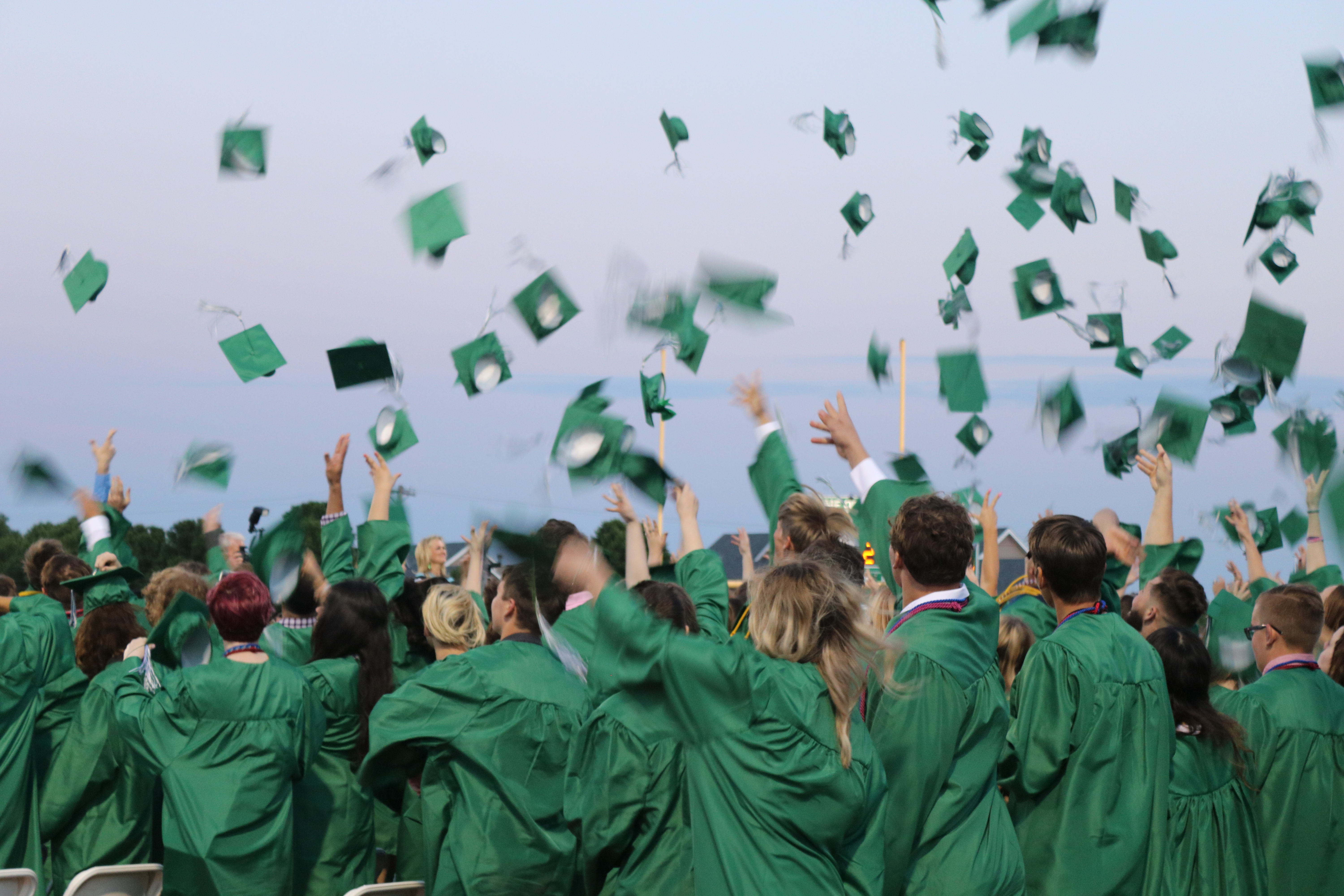 Graduates Throw Caps into Air