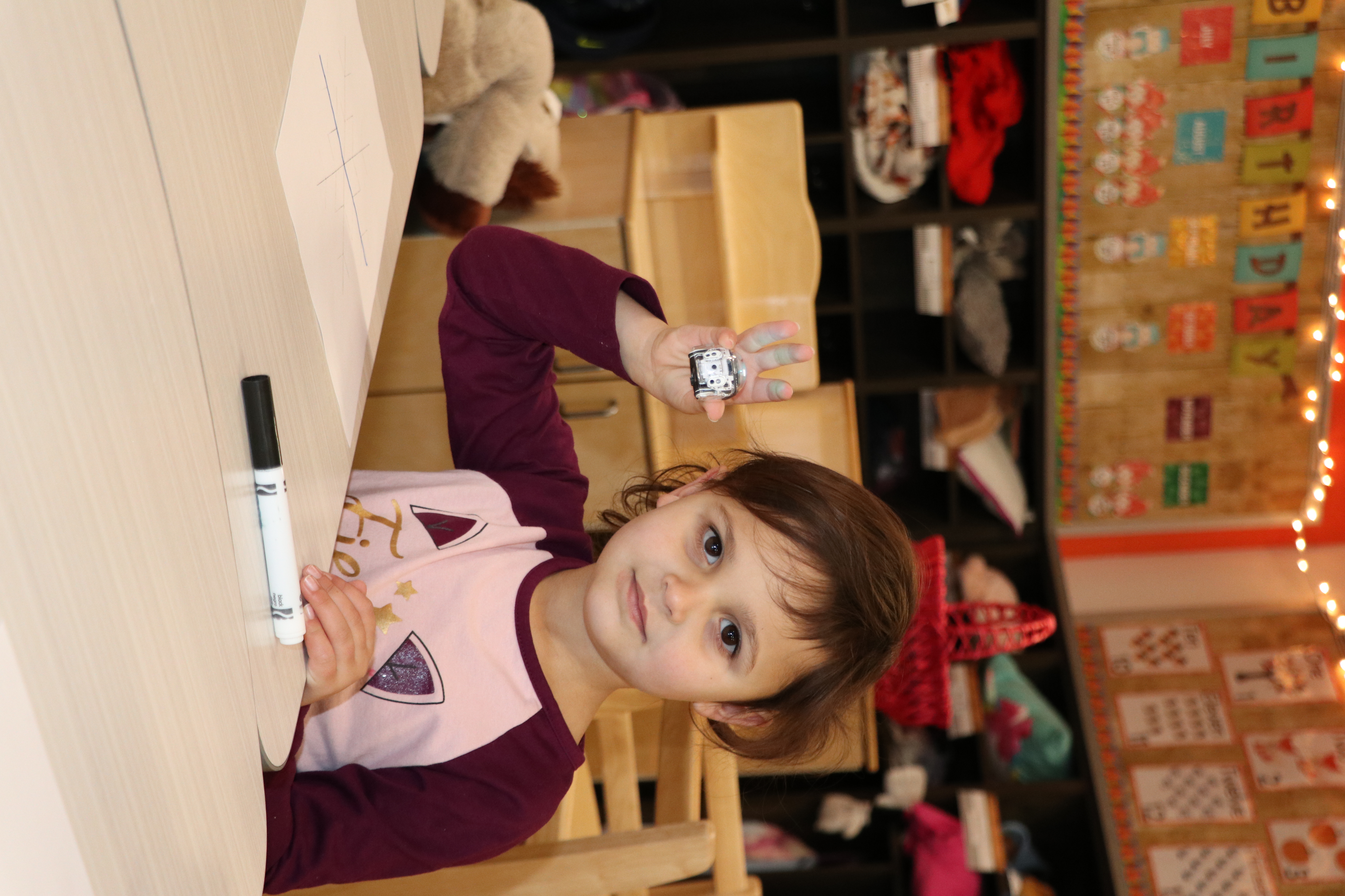 PreK girl showing mini robot