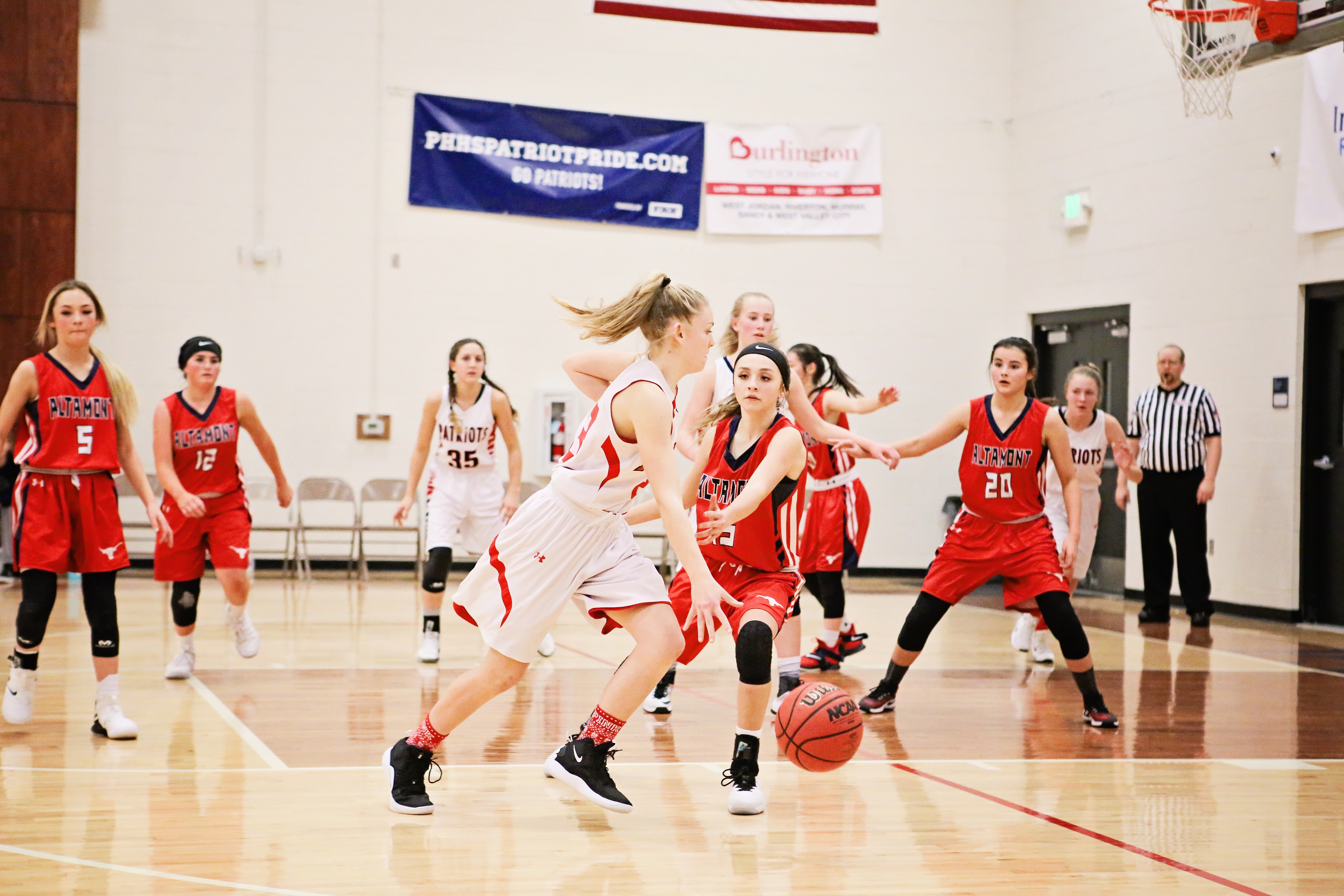 girls basketball team playing in a game