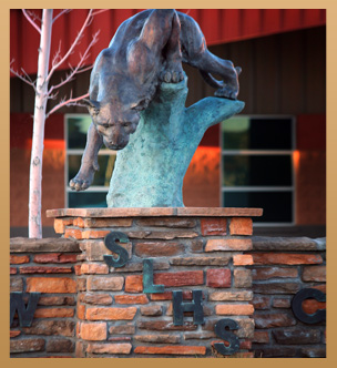 A statue of a cougar outside of Show Low High School