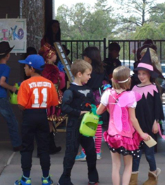 a group of students in Halloween costumes
