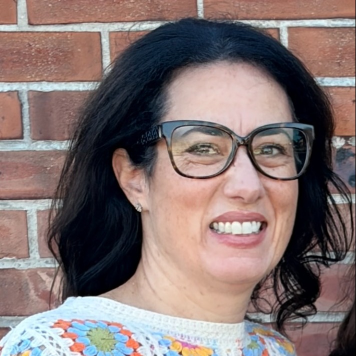 women smiling at the camera