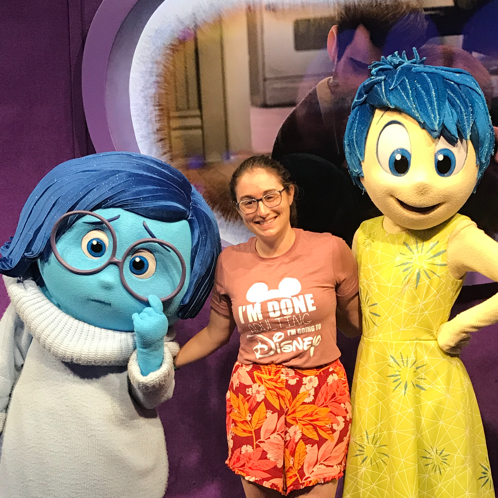 adult female posing with inside out characters
