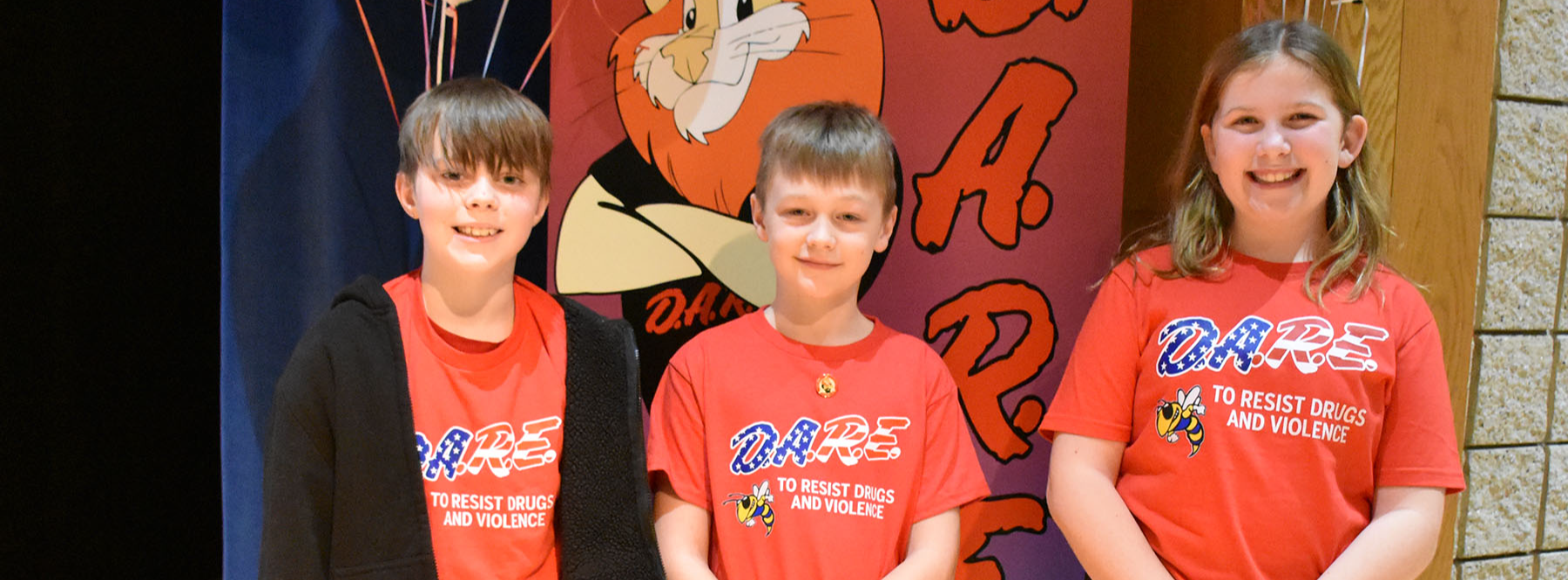 Three students in DARE tshirts. 