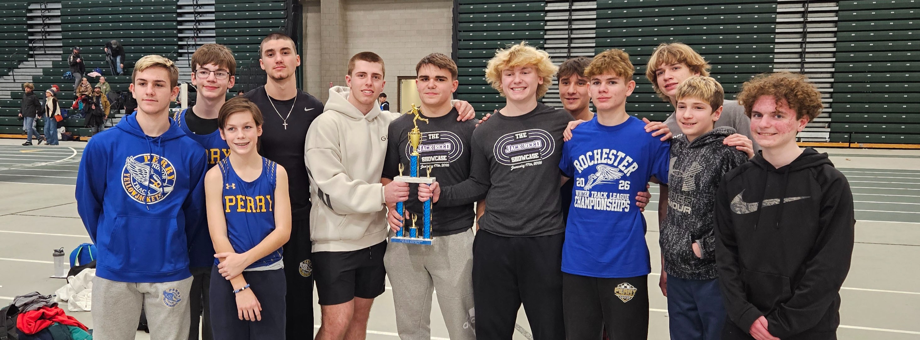 A group of boys holding a trophy 