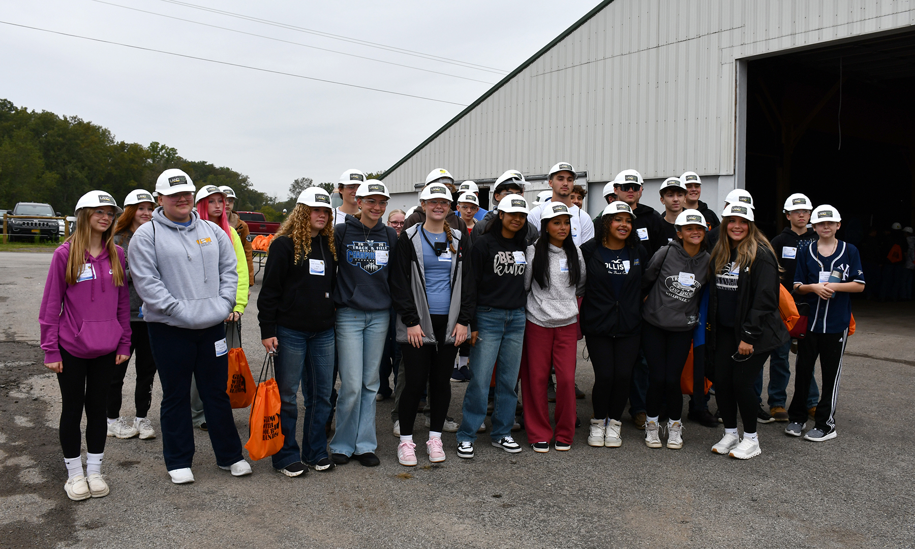 A group of students wearing hard hats.