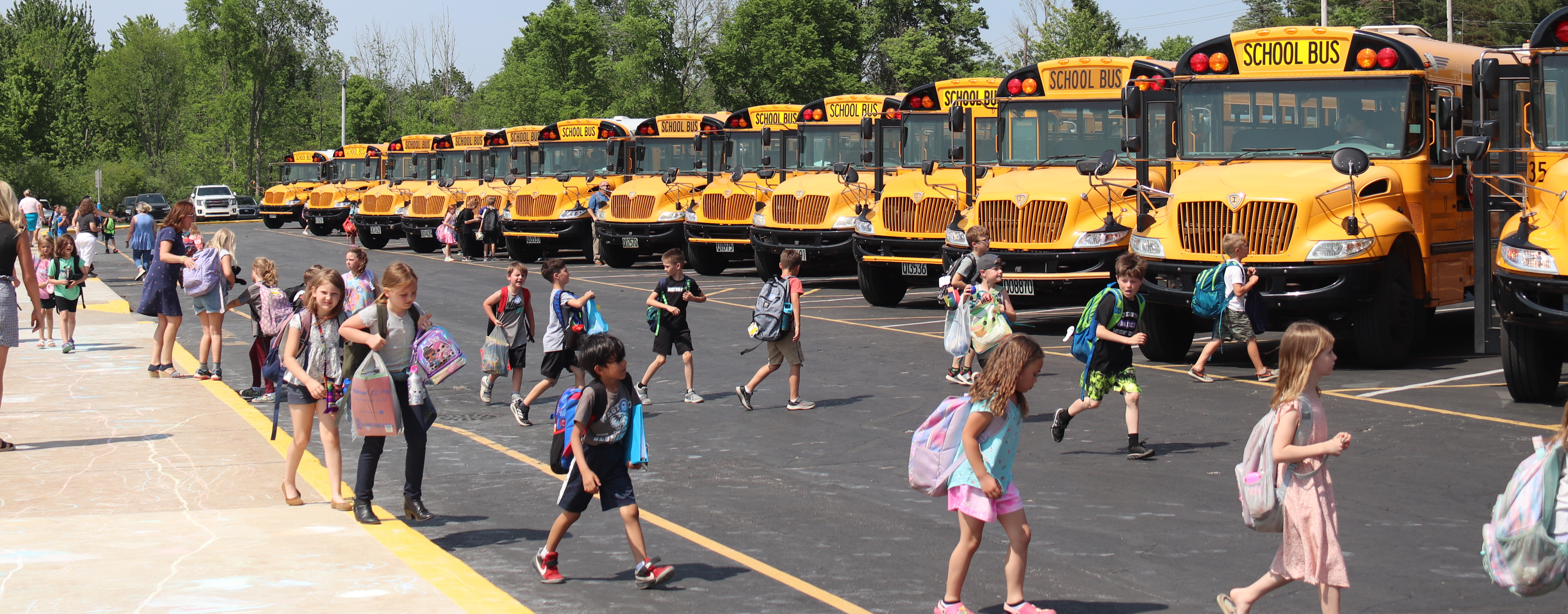 Students boarding school busses