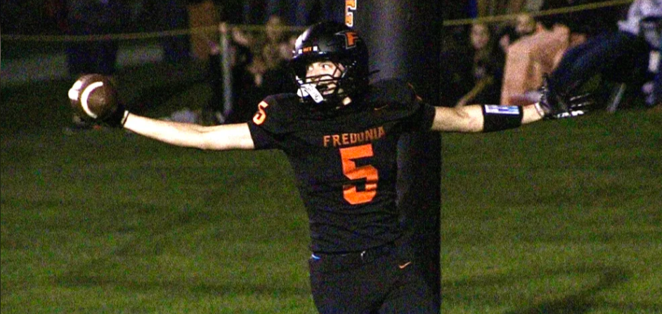 Football player scoring a touchdown.
