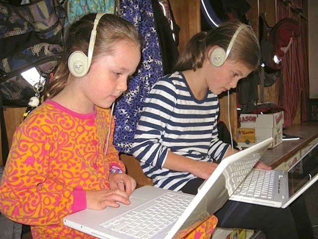 photo of students working on laptops
