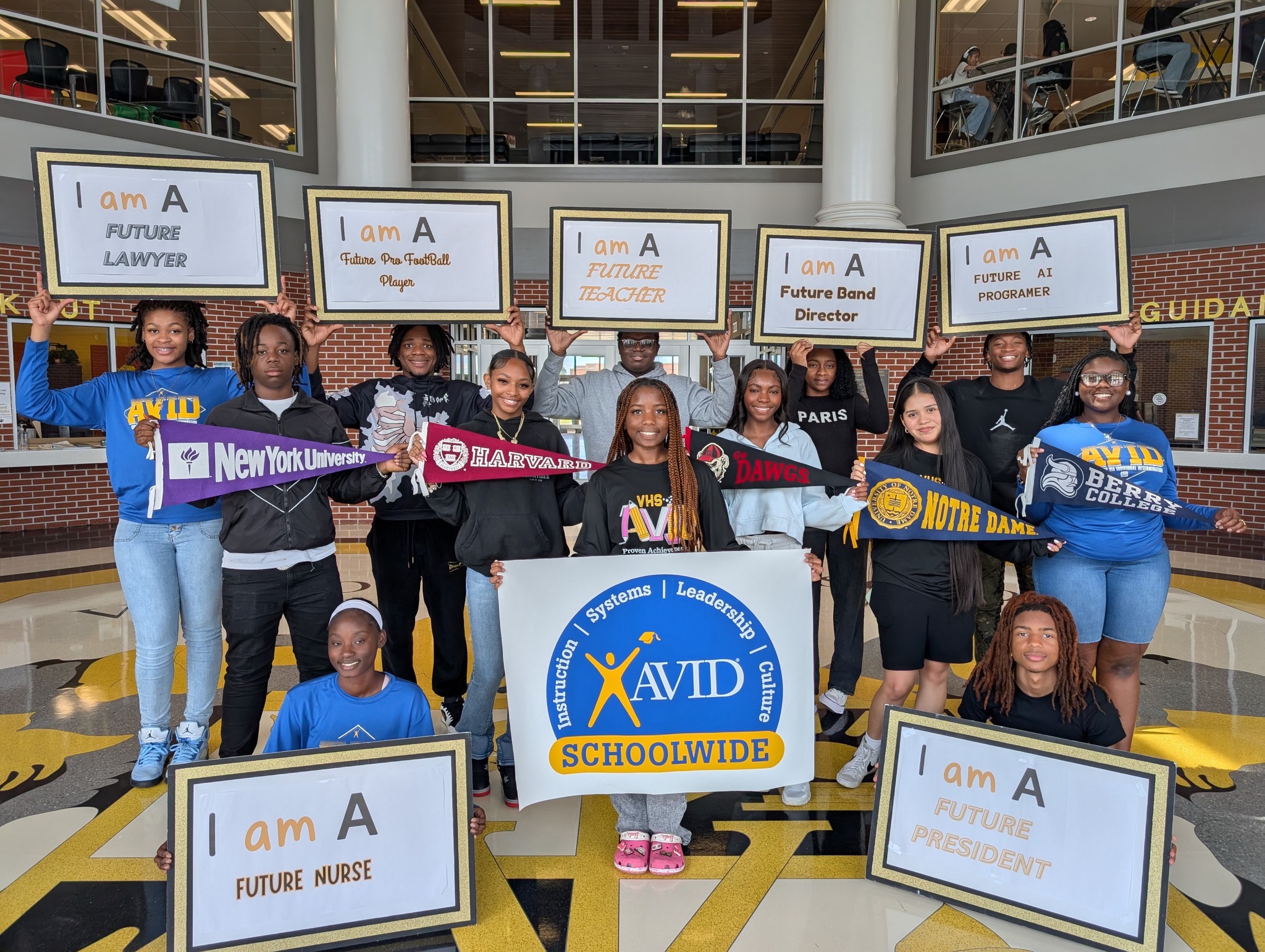 students holding college banners and affirmative posters