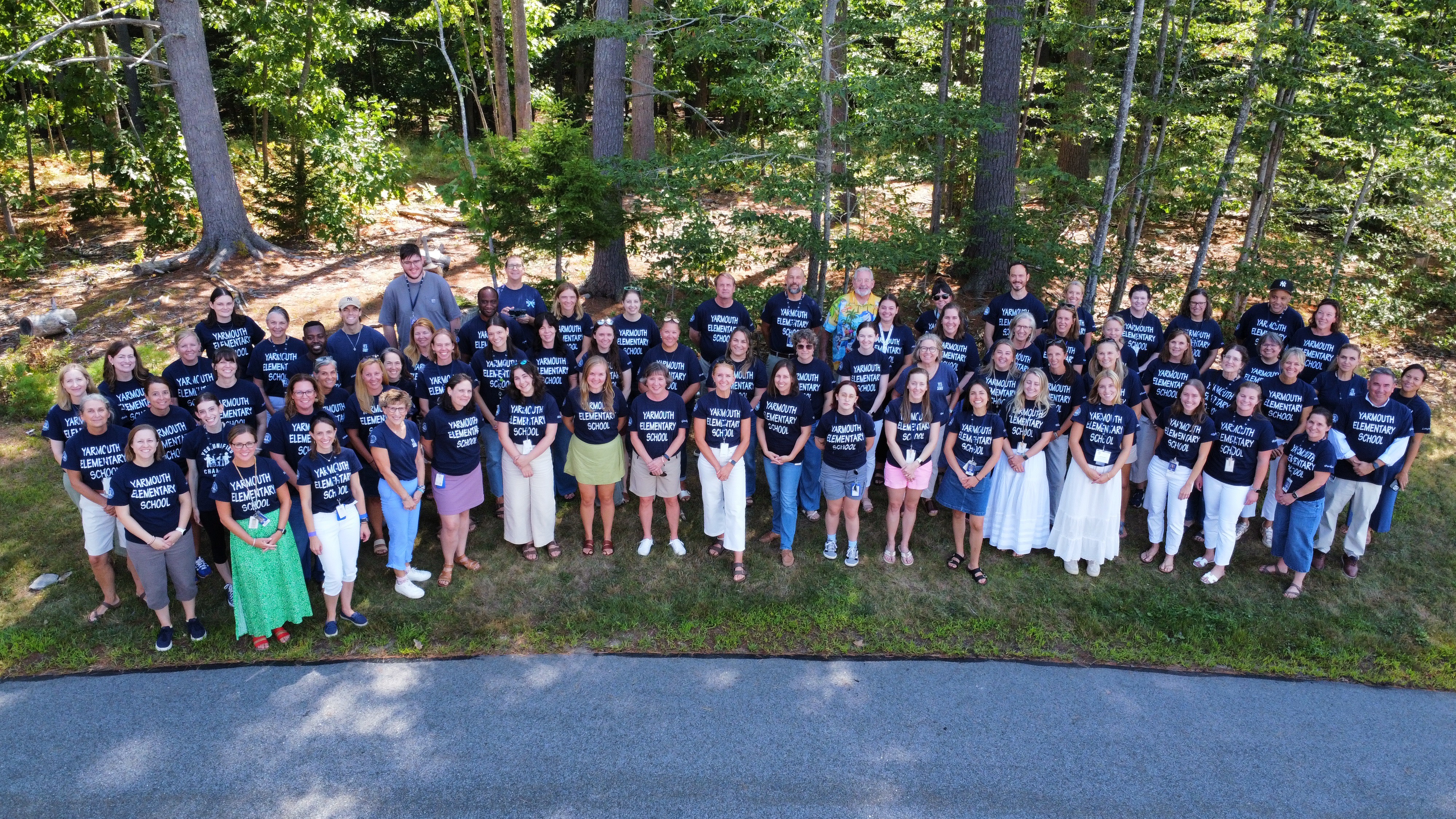 Yarmouth Elementary School staff standing outside the building