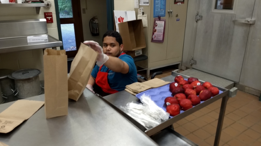MTC student prepares bagged lunches in Snow Cafeteria - spring 2018.