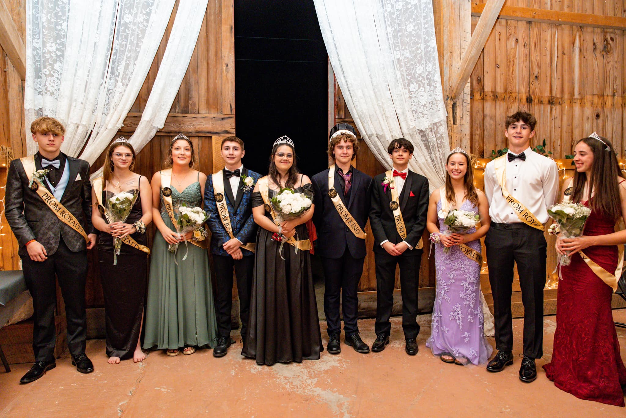 A prom court poses for a photo