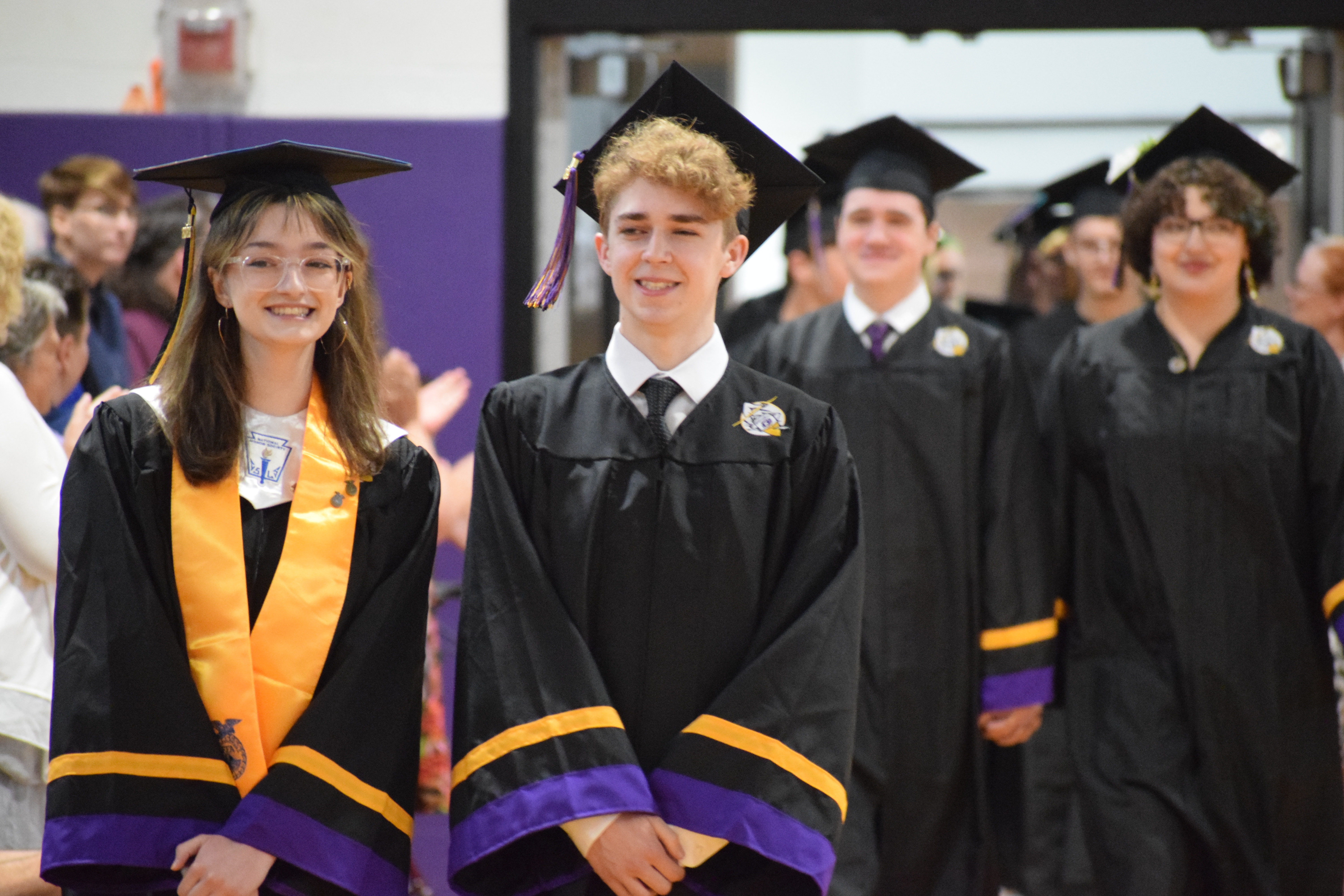 graduating students walking together