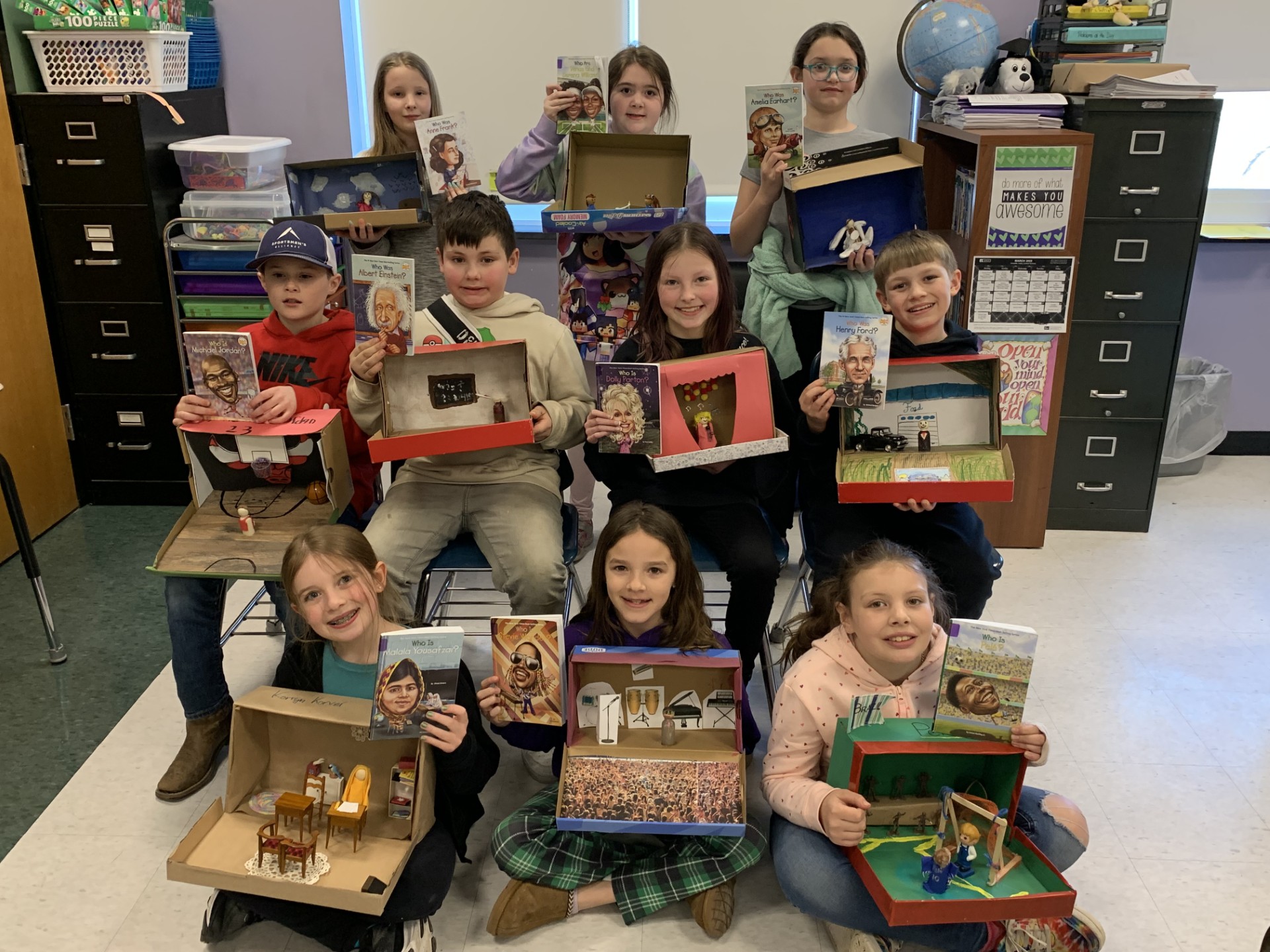 A class holds up book projects