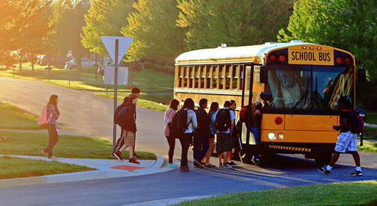 Kids boarding a school bus