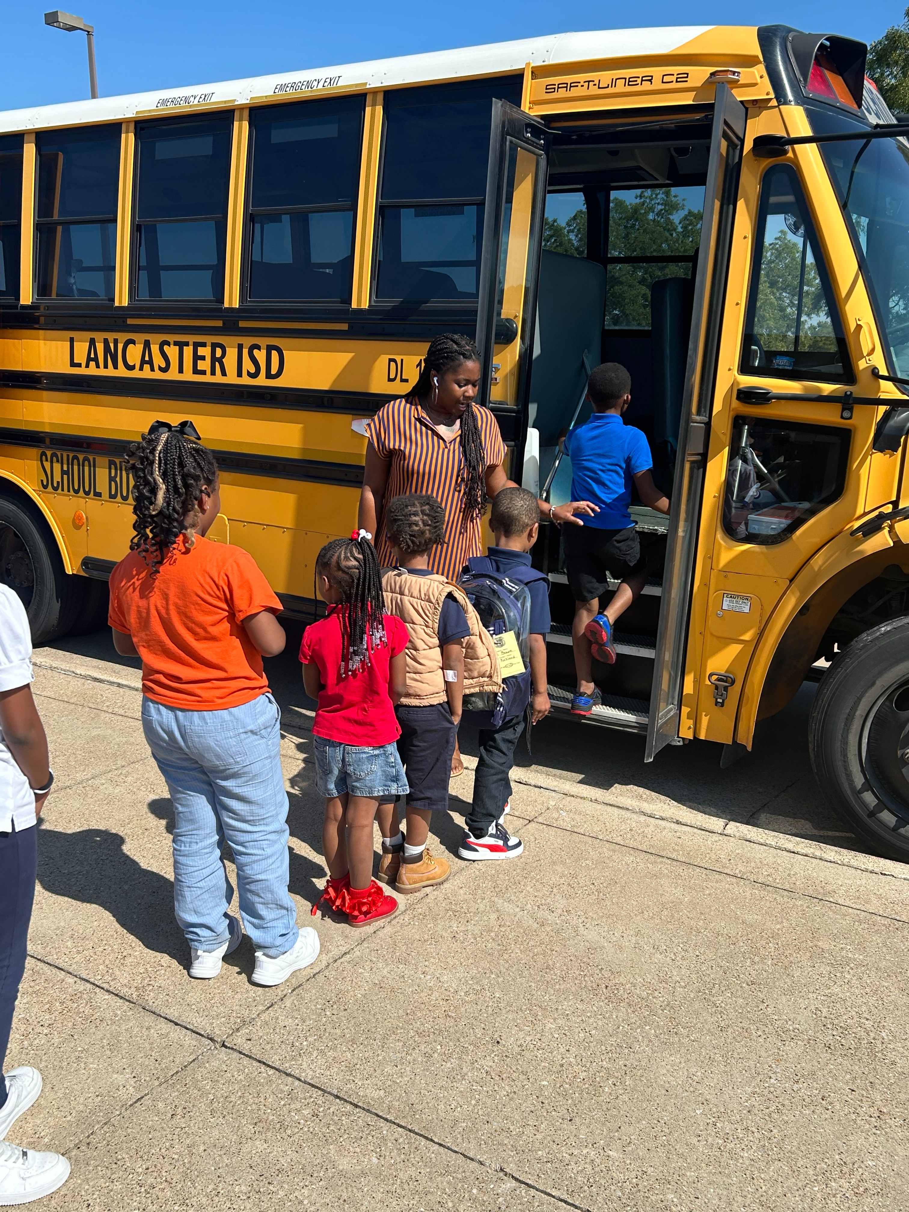Kids boarding a school bus