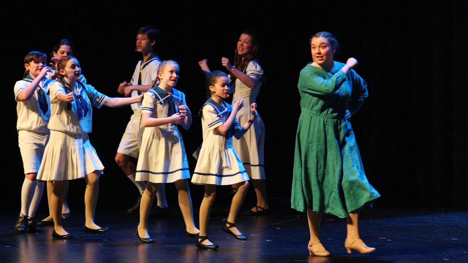 Maria and the Von Trapp children dancing during the Sound of Music