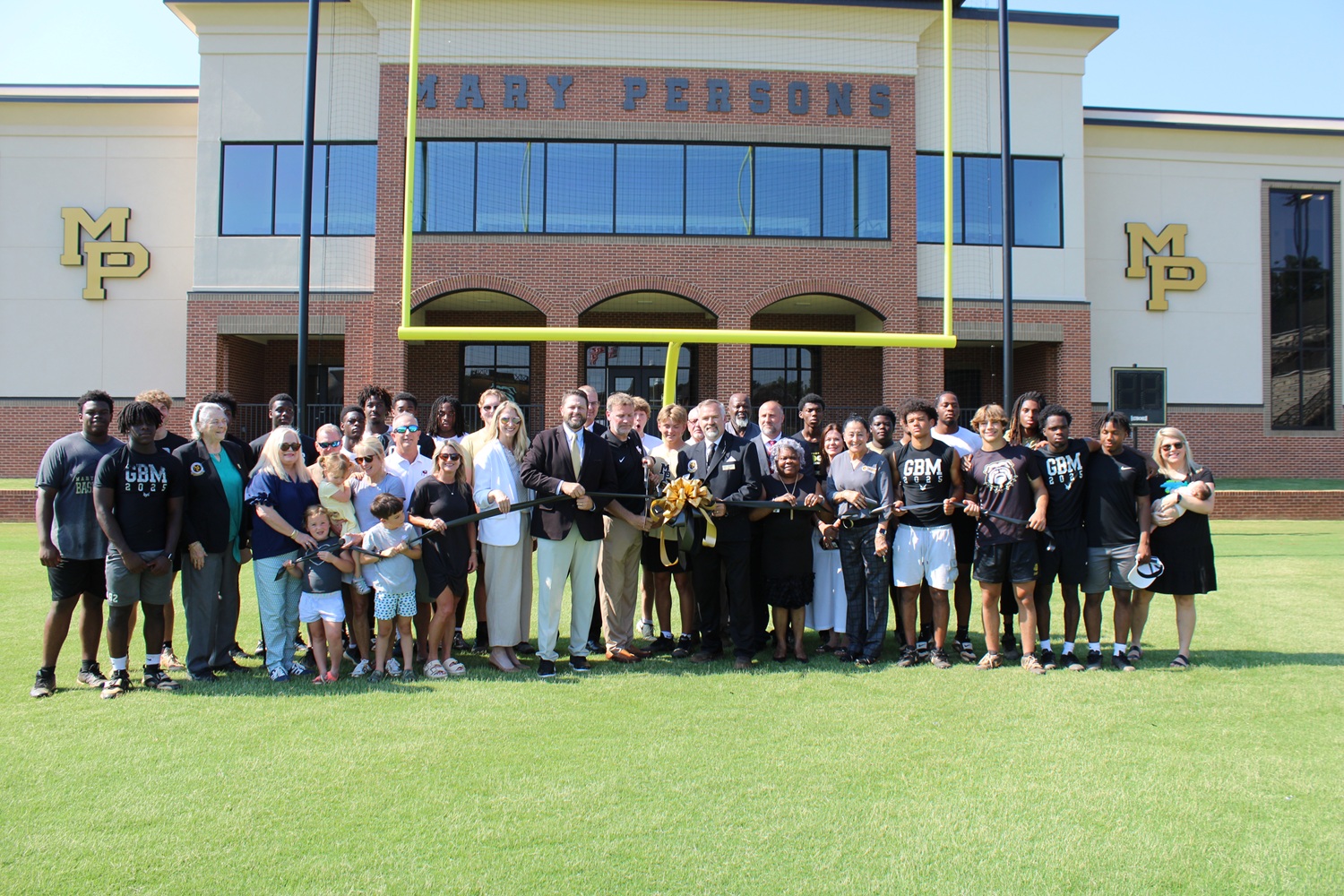 group photo at fieldhouse ribbon cutting