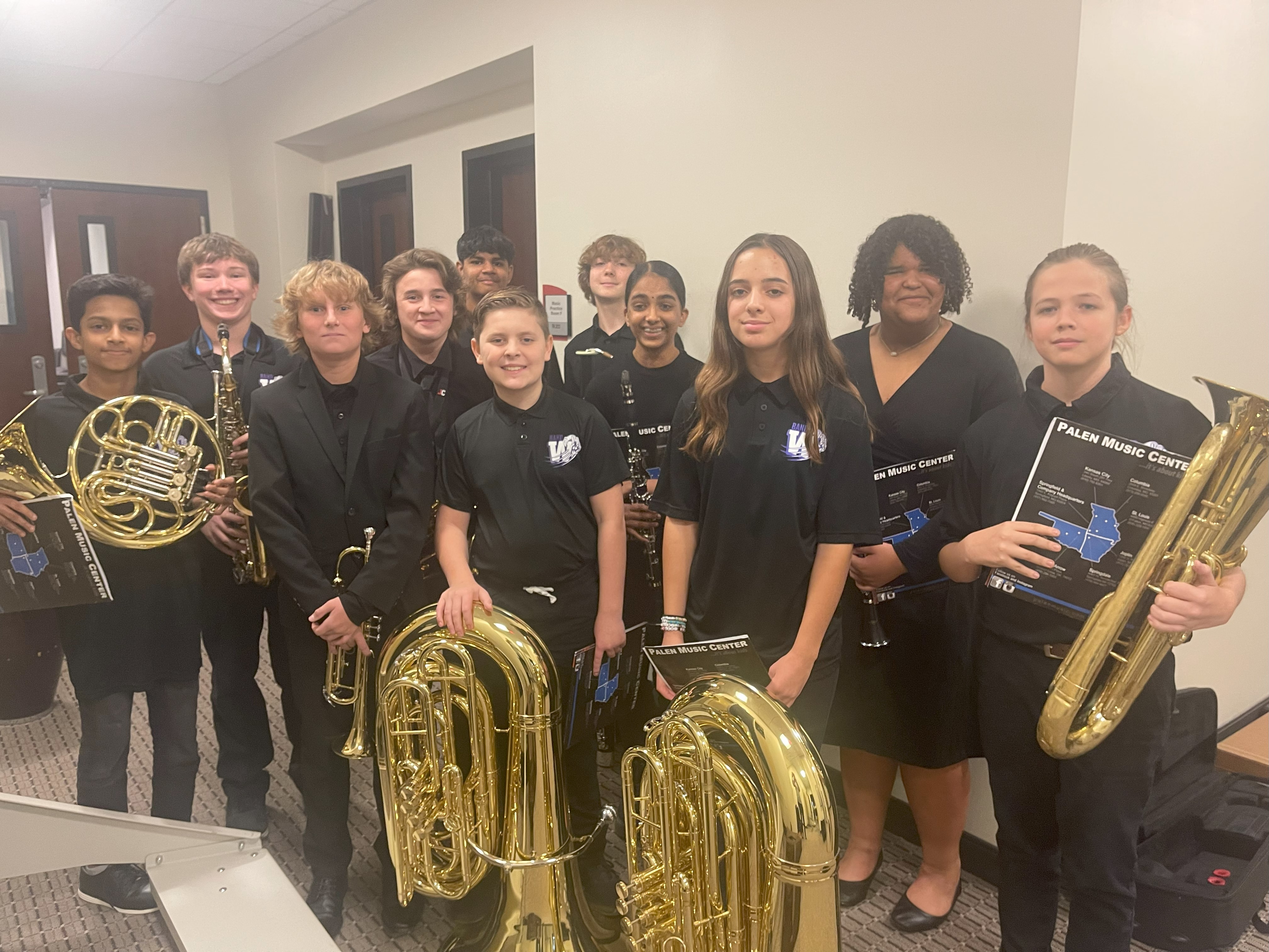All District Metro 8 Band members pose with their instruments