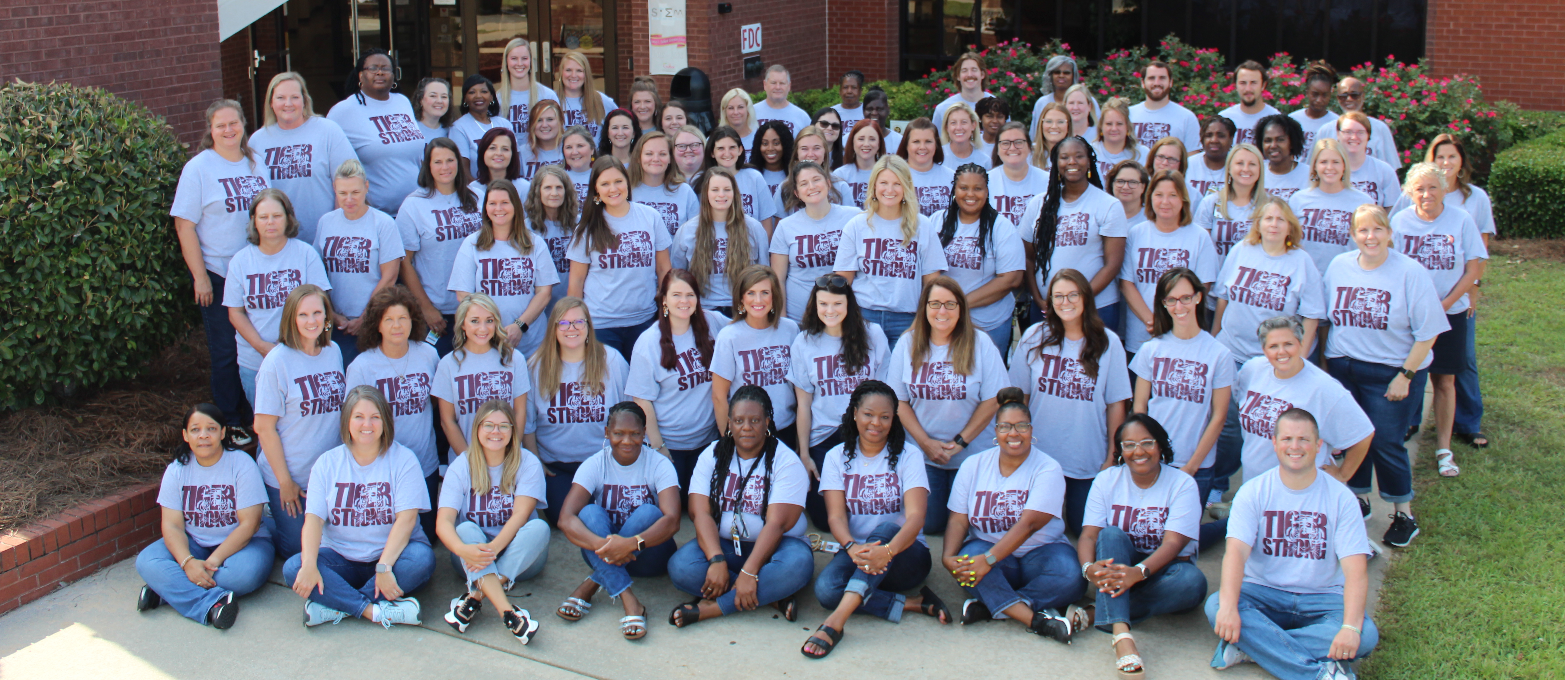 Hubbard staff photo in front of school