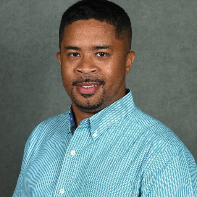 Tamarkis Taylor in a blue shirt