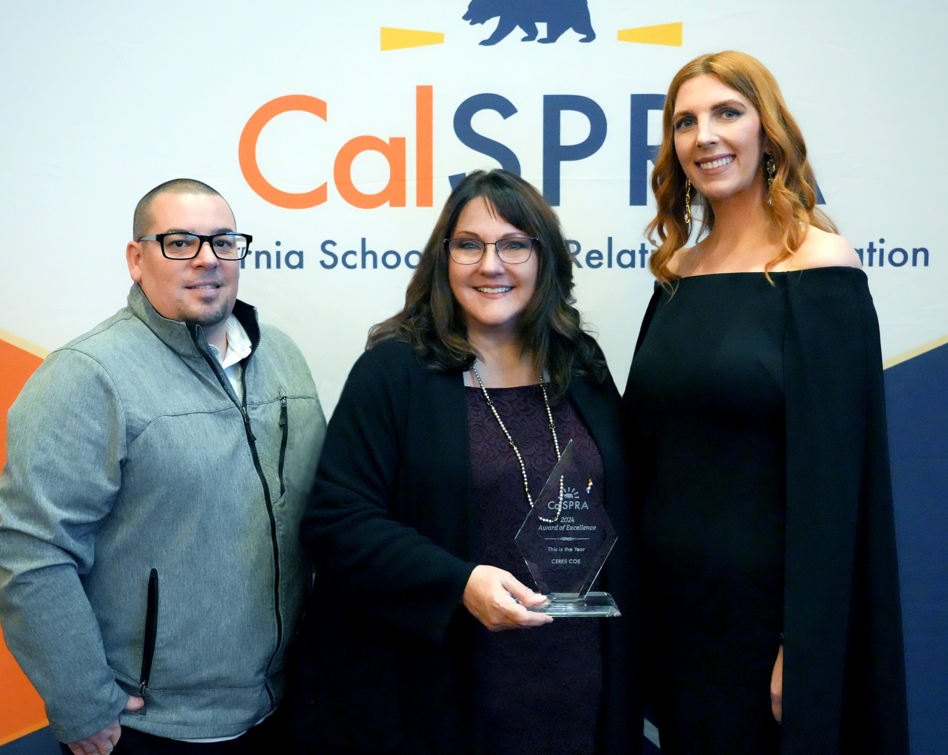 Communications team holding award with CalSPRA President