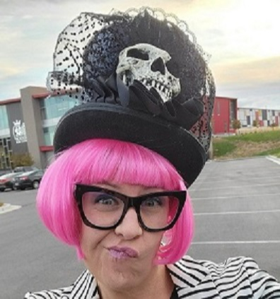 Ms. Rawson with pink wig and funny hat