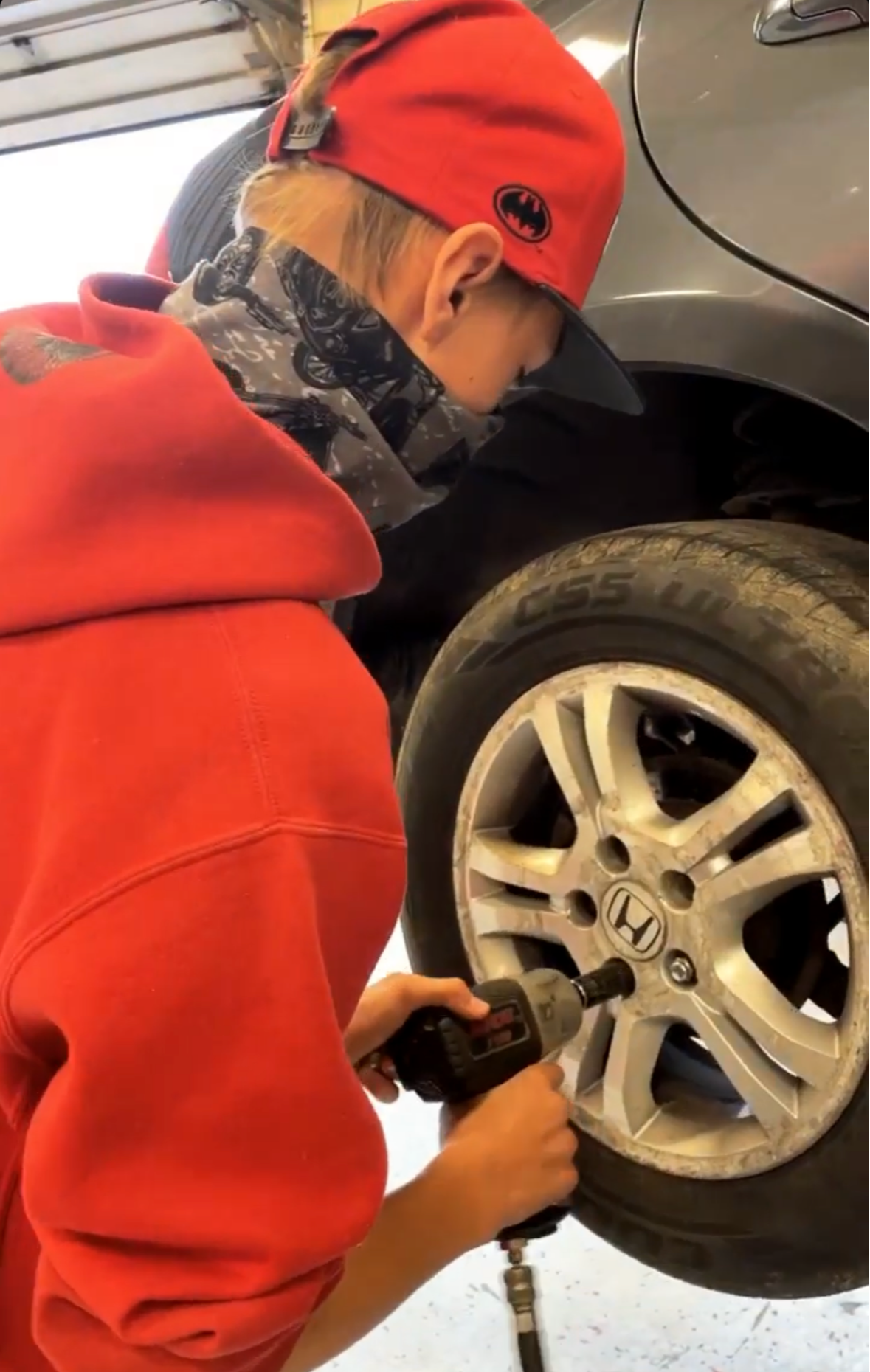 Outdoor Power student changing a tire
