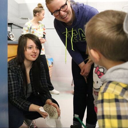 Animal science students with teacher