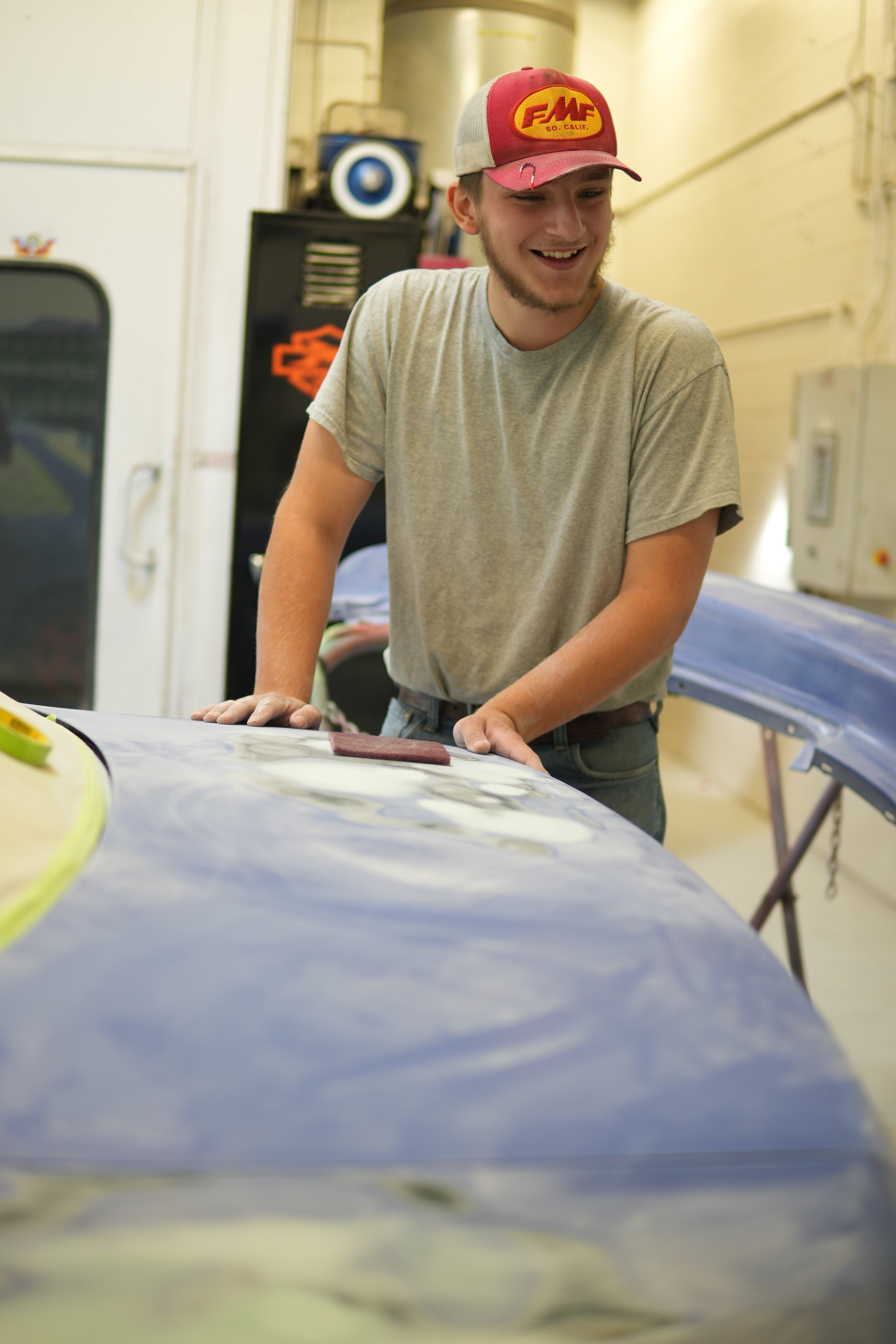 auto body student working