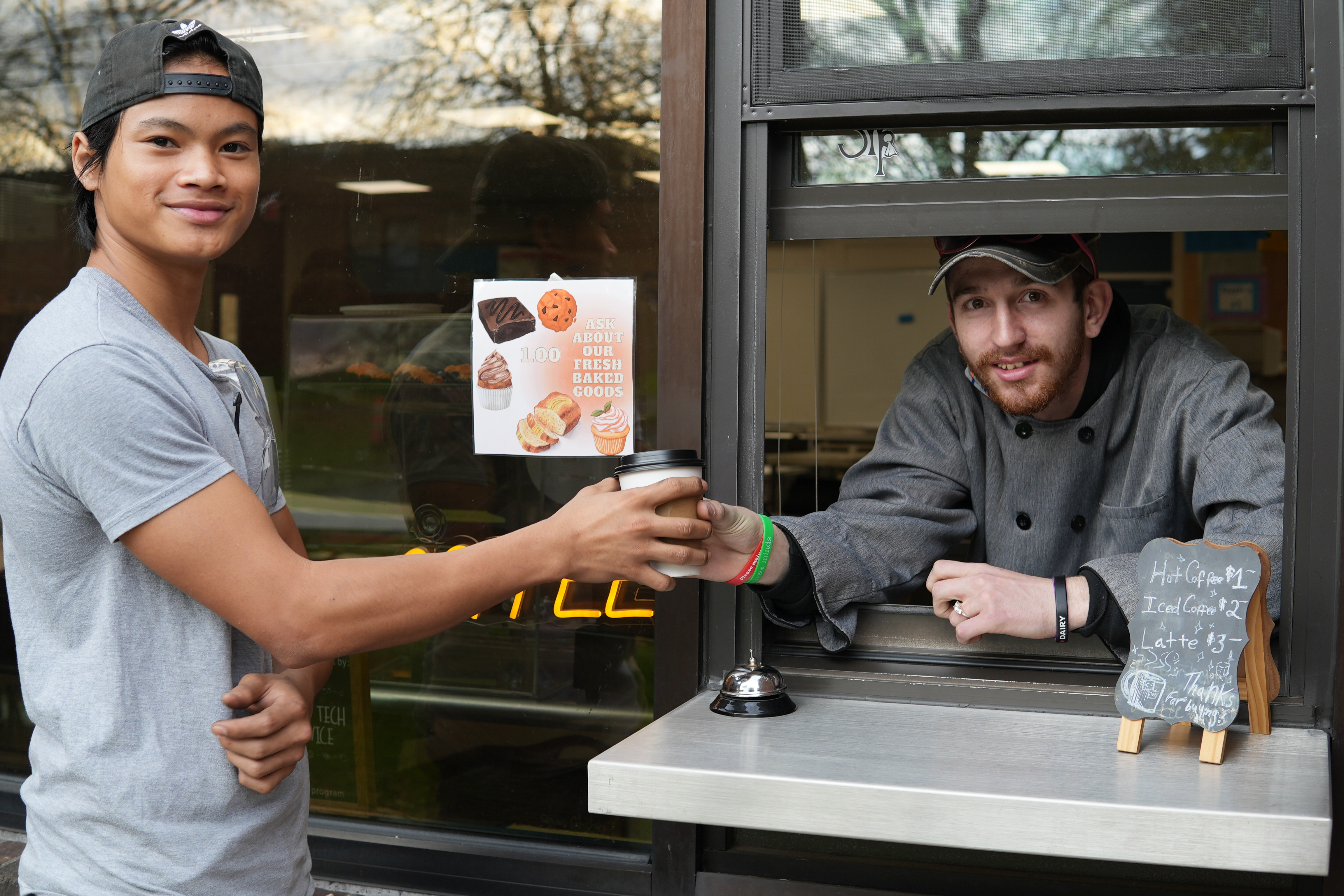 Food Service student serving coffee