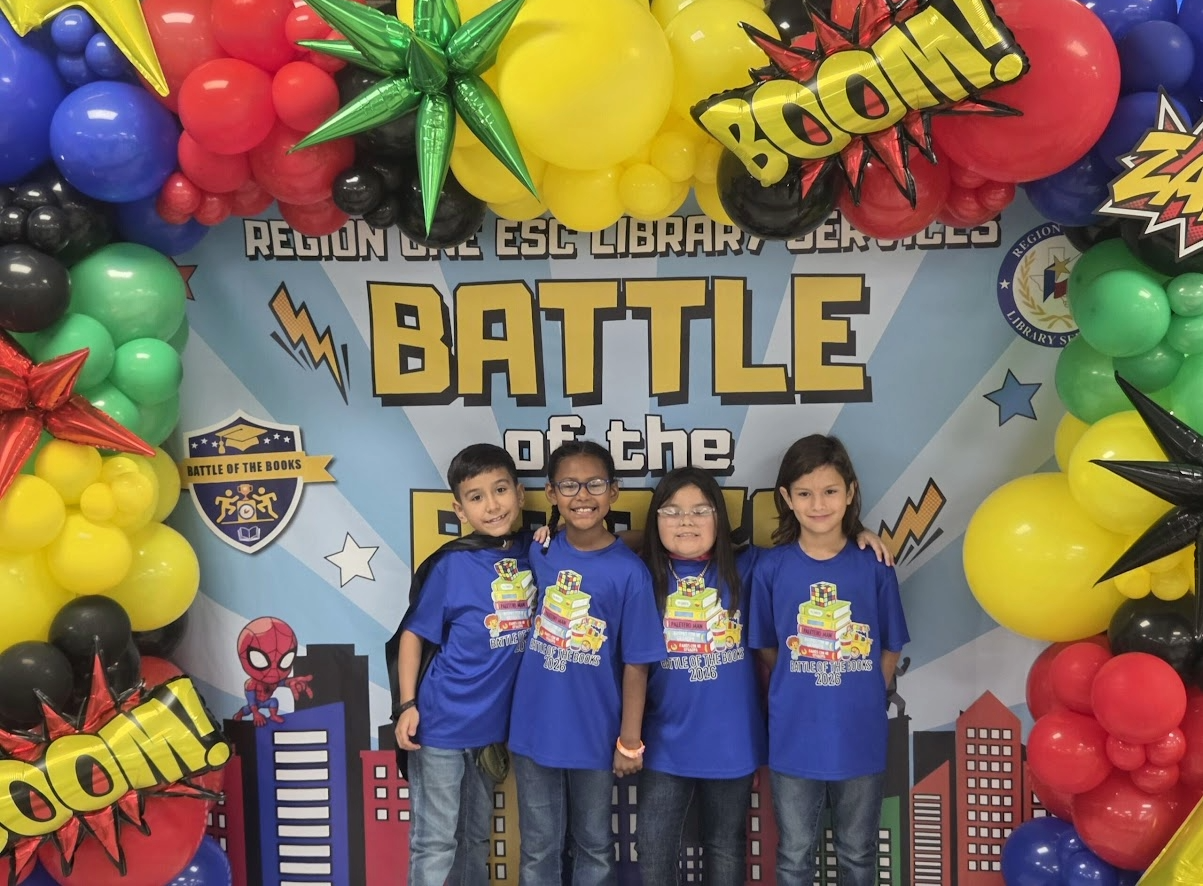 competing students posing in front of a backdrop at the regional battle of the books competition