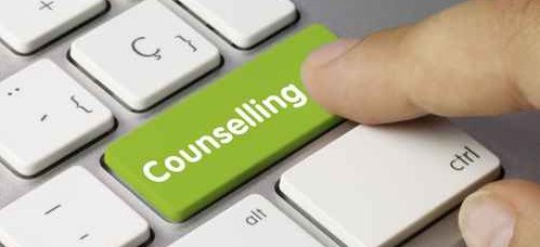 keyboard with finger on green counseling key