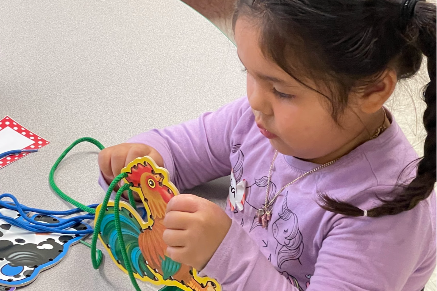 A Student Doing an Activity with the Early Learning Program