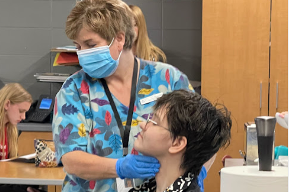 A Student and Teacher Doing an Activity with the Waukesha Academy of Health Professions