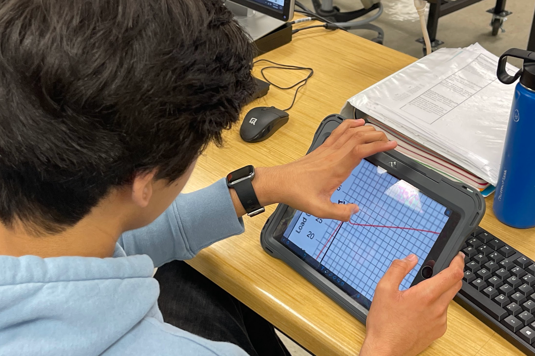 A Student Doing an Activity with the Waukesha Engineering Preparatory Academy