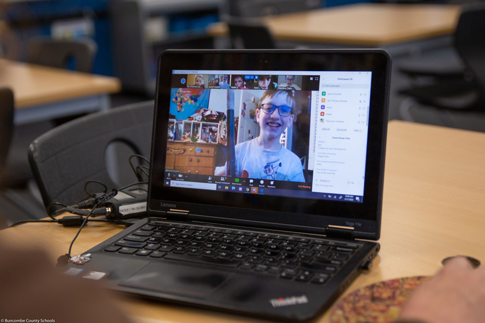 A laptop with a video conference open