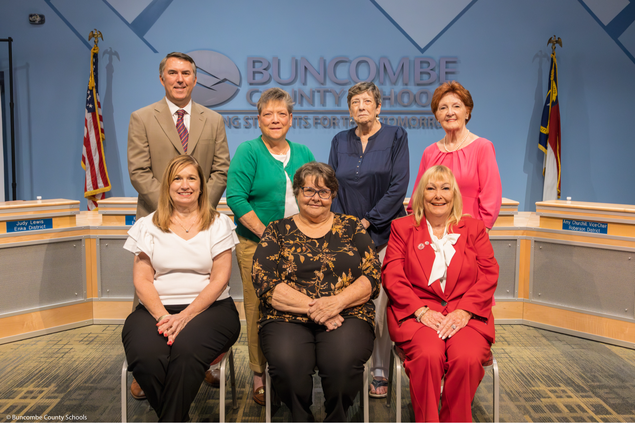 Members of the Buncombe County Board of Education. Seated, L-R, Ms. Amy Churchill, Madam Chair Ann Franklin, Ms. Kim Plemmons. L-R standing: Mr. Rob Elliot, Dr. Glenda Weinert, Ms. Peggy Buchanan, Ms. Judy Lewis