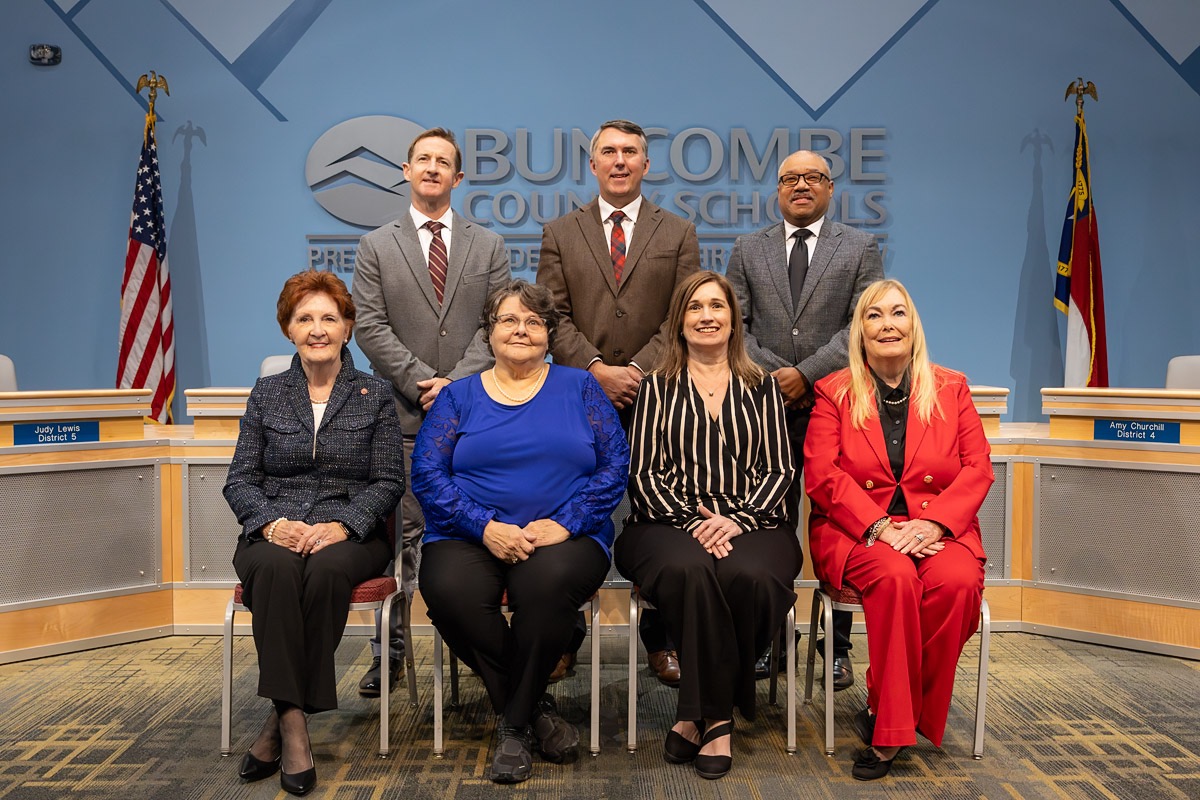 Members of the Buncombe County Board of Education. Seated, L-R, Ms. Amy Churchill, Madam Chair Ann Franklin, Ms. Kim Plemmons. L-R standing: Mr. Rob Elliot, Dr. Glenda Weinert, Ms. Peggy Buchanan, Ms. Judy Lewis